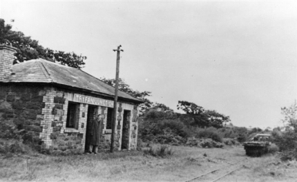 Tryfan Junction - Demolition train to the right, and an observer in the doorway